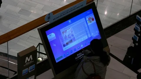 SWEDEN: People using big touch screen to get information in a public place Stock Footage 71147182