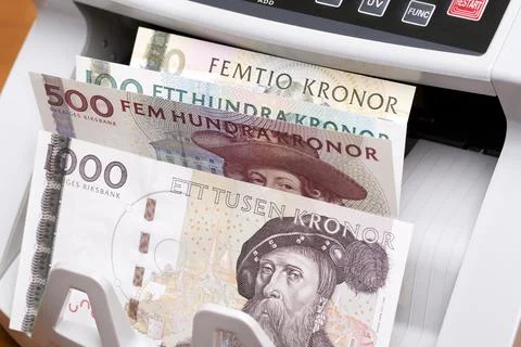 Swedish crown in the counting machine Stock Photos