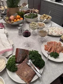 Swedish Easter lunch with eggs herring bread and drinks on festive table Foto stock