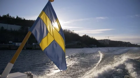 Swedish flag blowing in the wind Stock Footage