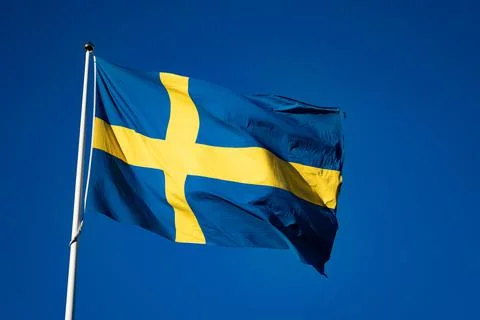 Swedish flag on the sky background Stock Photos