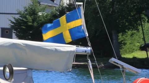 Swedish flag waves on boat Stock Footage 27556609
