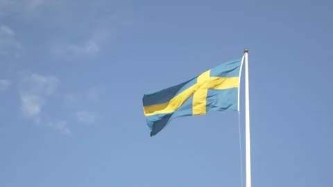 The Swedish flag waving in the wind. Slow moation video footage. Stock Footage 132072298