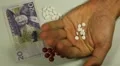 Swedish Krona SEK, Counting Drugs and Money, Health Care, Colorful Pills HD Footage