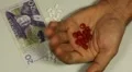 Swedish Krona SEK, Counting Drugs and Money, Health Care, Colorful Pills HD Footage