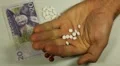 Swedish Krona SEK, Counting Drugs and Money, Health Care, Colorful Pills HD Footage