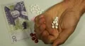 Swedish Krona SEK, Counting Drugs and Money, Health Care, Colorful Pills HD Footage