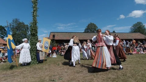 Swedish midsummer may pole dance in Stockholm suburb Sollentuna. People circling Video stock 119233604