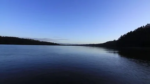 Sweep over lake at dawn Stock Footage 77044639