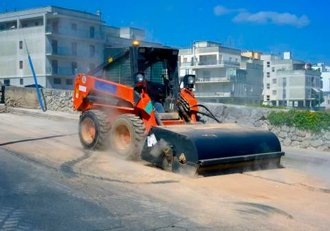 Sweeper attachments mini excavator. Stock Photos