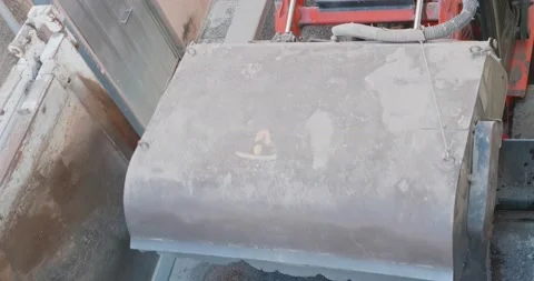 Sweeper attachments mini excavator. The sweeper sweeps, collects and dumps di Video stock 183800885