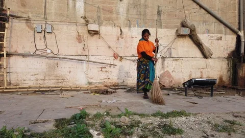 Sweeper cleaning the ghat Stock Footage 116548762