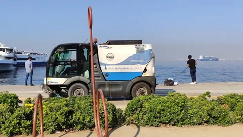 Sweeper cleans the promenade Stock Footage 119042109