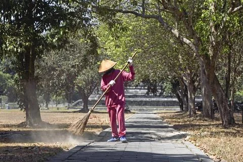 Sweeper in front of Sewu Temple Compound, 8th century Buddhist temple located at Stock Photos