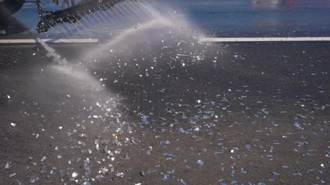 Sweeper Pour Water The Road Under Pressure Cleans The Asphalt From Dirt Video stock 99770118