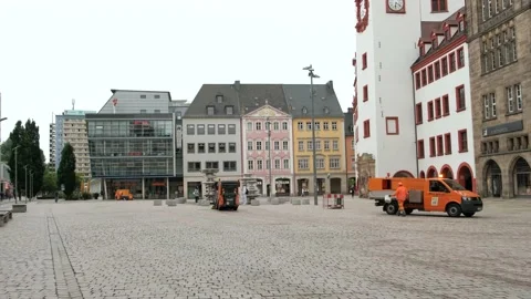 A  sweeper with two front brushes cleans the area in the evening after trade Stock Footage 221552423