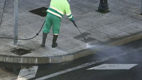 Sweeper Worker cleaning a street sidewalk Video stock 168763302