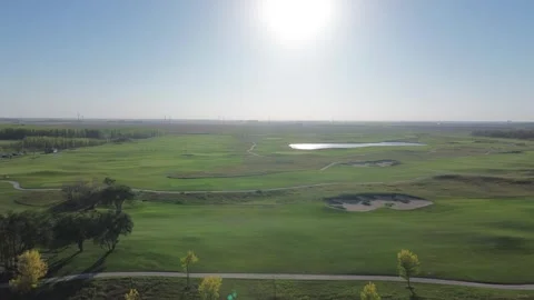 Sweeping Aerial Drone Flight Over a Sunny Golf Course Stock Footage 317967751