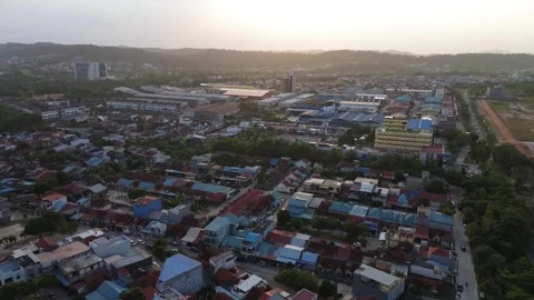 Sweeping aerial gaze over an evolving town, capturing sun-kissed roofs and .. Stock-Footage 339033910