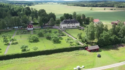 Sweeping aerial shot of historic Marbacka manor house, Establishing shot Stock Footage 346752134