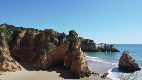 Sweeping aerial view of Alvor's pristine beach and cliffs. Stock Footage 266699861