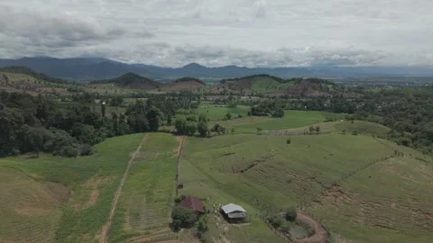 Sweeping Aerial View of Multi-Wave Green Hills, Winding Paths and Misty Mou.. Vídeos de archivo 337529659