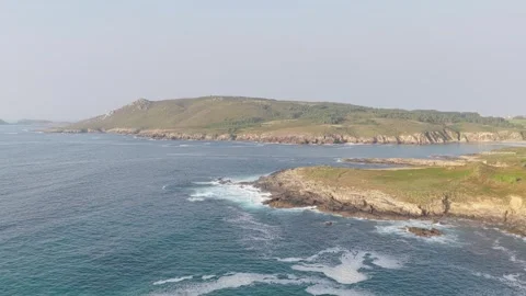 A sweeping aerial view of the rugged coastline at Praia De Seiruga, Spain Stock Footage 346710863