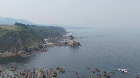 A sweeping aerial view of the rugged coastline near El Peine del Mar in Stock Footage 346713295