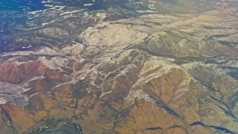 Sweeping Alpine Terrain with Snow Covered Ridges and Textures Stock Footage 337948740