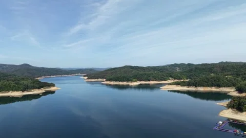 Sweeping Calm Mountain Reservoir Surrounded by Forest, Aerial View Stock Footage 344778396