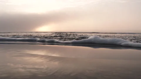 Sweeping Camera Shot Over Ocean Beach At Sunset Stock Footage 254806512