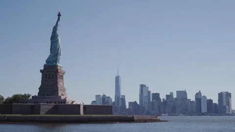 Sweeping Cinematic Shot of the Statue of Liberty New York City in Background Stock Footage