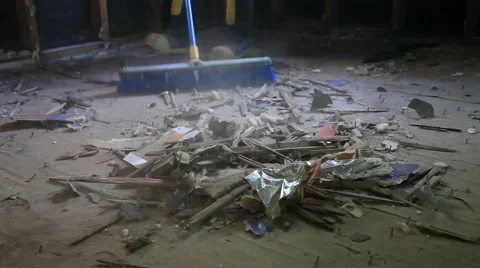 Sweeping a Dirty Deconstructed Floor with a Push Broom Stock Footage 45361302