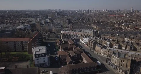 Sweeping drone footage of South London, England, during a bright sunset. Stock Footage