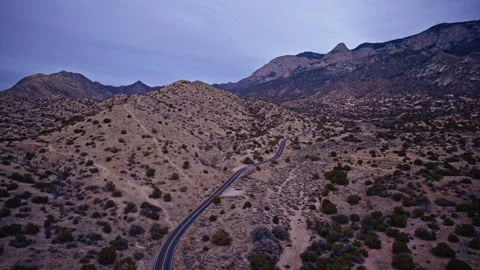 Sweeping drone shot over New Mexico’s desert landscape framed by mountains 動画素材 332739005