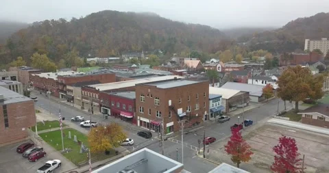 Sweeping Drone Shot of Small Rural Town on Foggy Morning Stock-Footage 231230552