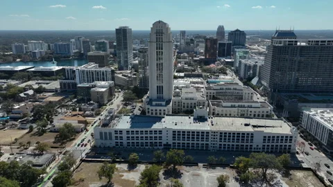 A sweeping drone view reveals the Orange County Clerk of Courts building set Stock Footage 330990399