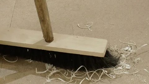 Sweeping the floor with a broom Stock Footage 86160495