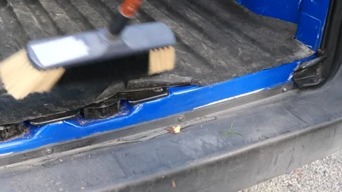 Sweeping the floor of a small van after a day's work Video stock 333698560