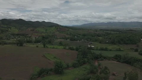 Sweeping High Altitude Aerial Over Mountain Valley, Blue-Grey Clouds and Gr.. Stock Footage 337393553