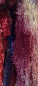 Sweeping mauve tendrils of hand dyed silk lapp fiber Stock Photos