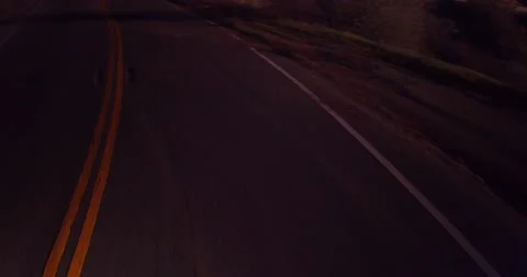 Sweeping motion view of empty winding road in the mountains Stock Footage 136337877