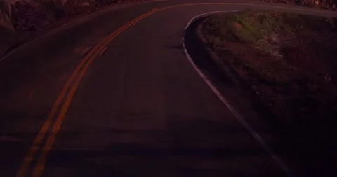 Sweeping motion view of empty winding road in the mountains Stock Footage 136337919