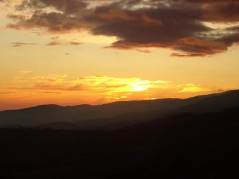 Sweeping mountain landscape at sunset Stock Photos