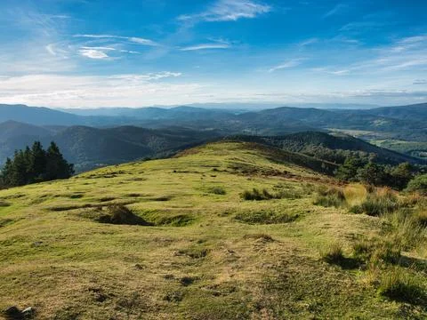 Sweeping mountain range view under a blue sky - A wide-angle landscape of m.. Stock Photos