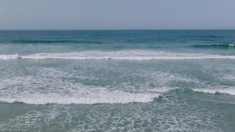 Sweeping Ocean View With Waves Rolling On Shoreline During Summer Stock Footage 238805541