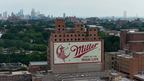 Sweeping orbital drone shot around the expansive Miller Brewing Company complex Stock Footage 342848605