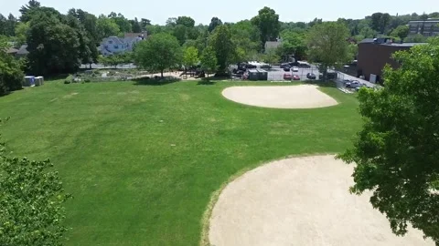 Sweeping Over Baseball Fields on a Bright Sunny Day Video stock 243288926