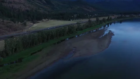 Sweeping Riverside Road Drone Shot Video stock 146480092