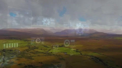 Sweeping rural valley centering while AR interface activating, faint HUD panels Stock Footage 332405590